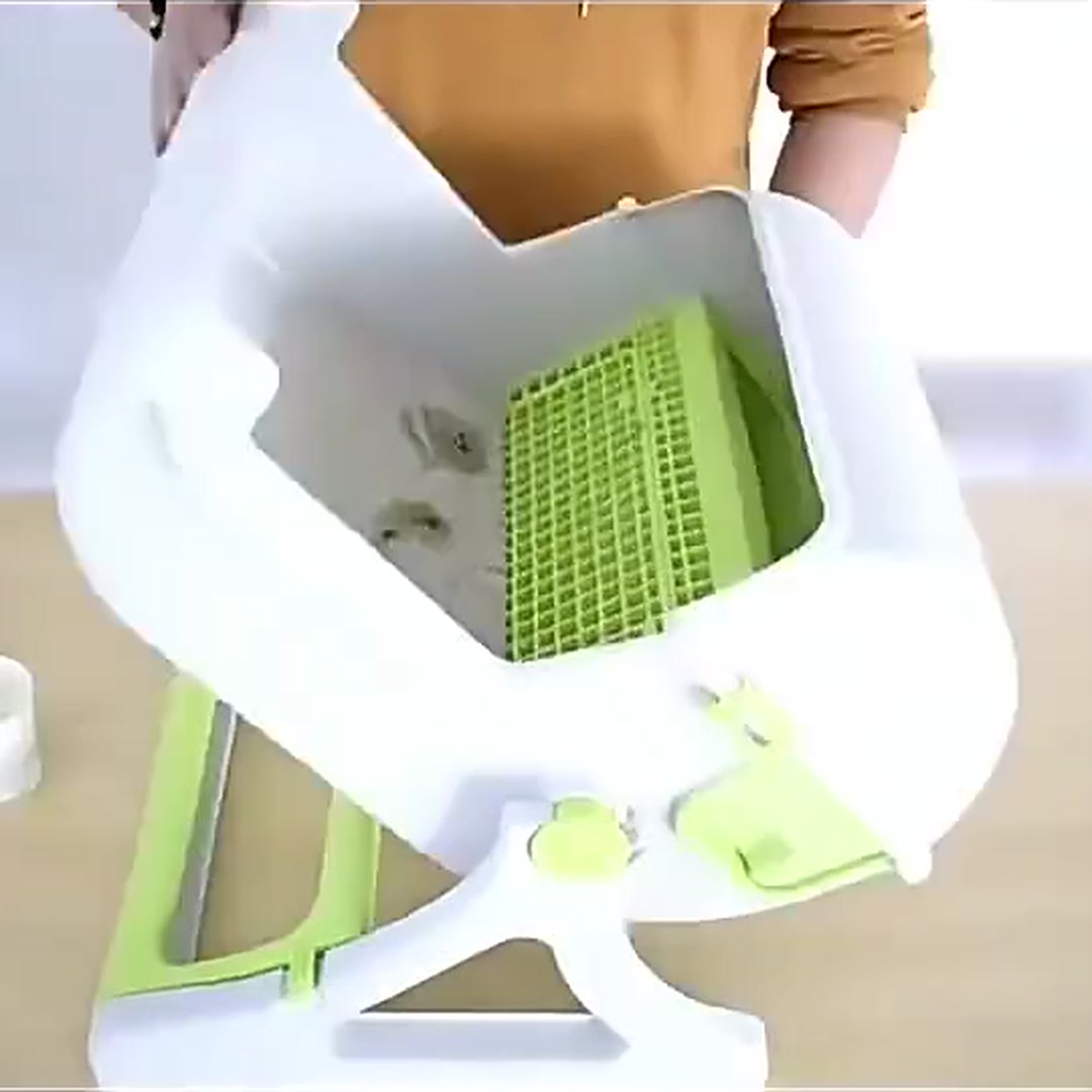 Hands rolling the OneRoll litter box over to begin the ten-second clean