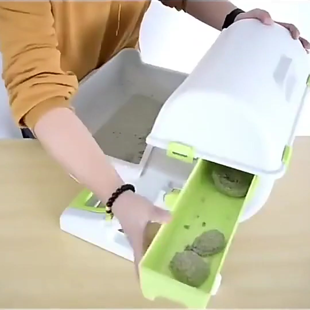 Pull-out waste tray removed from the OneRoll with sifted clumps inside, clean litter left behind